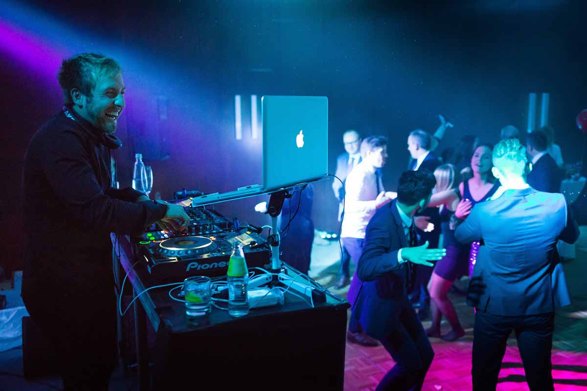 Guests of the Prague private party dancing during the professional DJ set