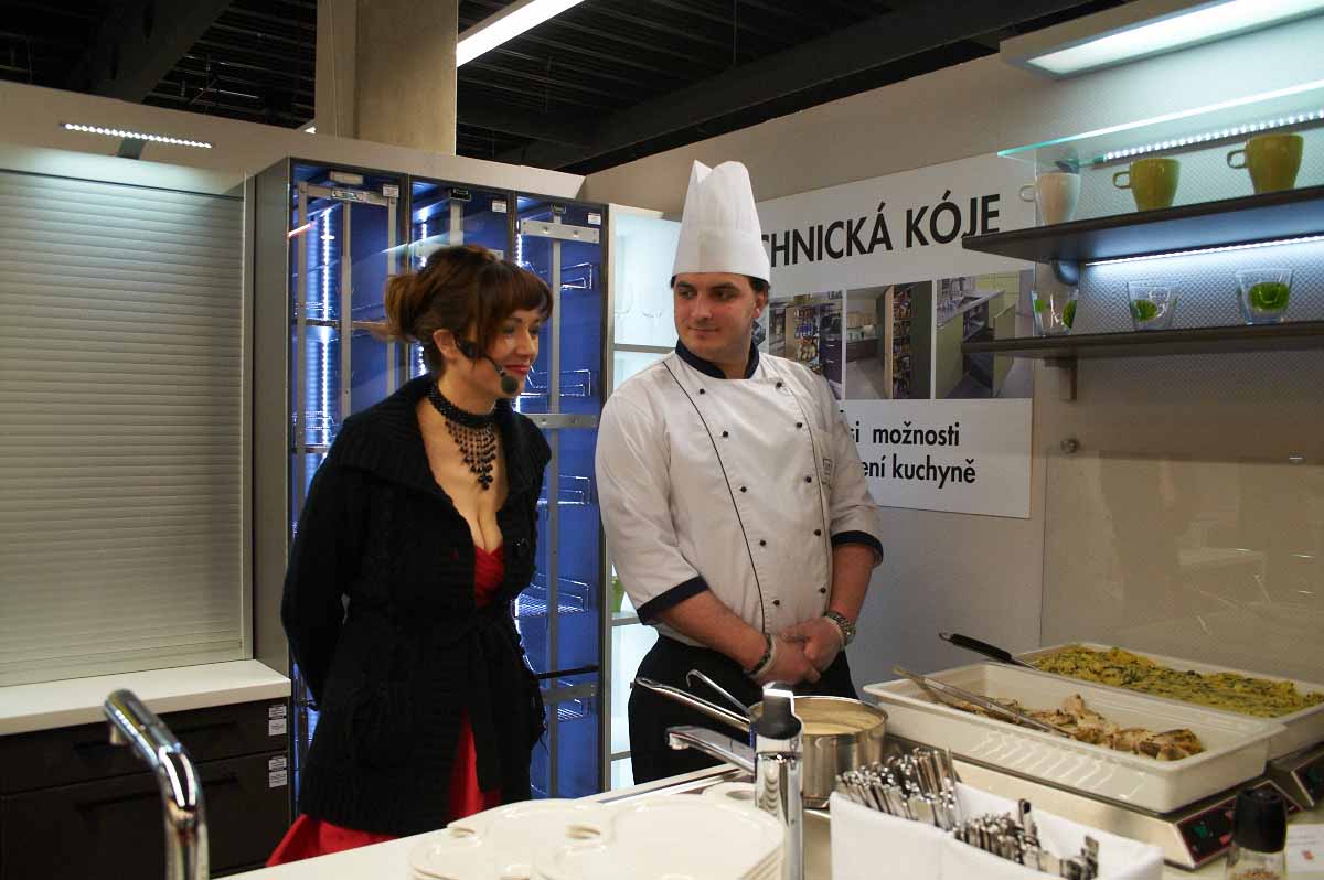 Professional host interviews the show cook during grand opening in Prague